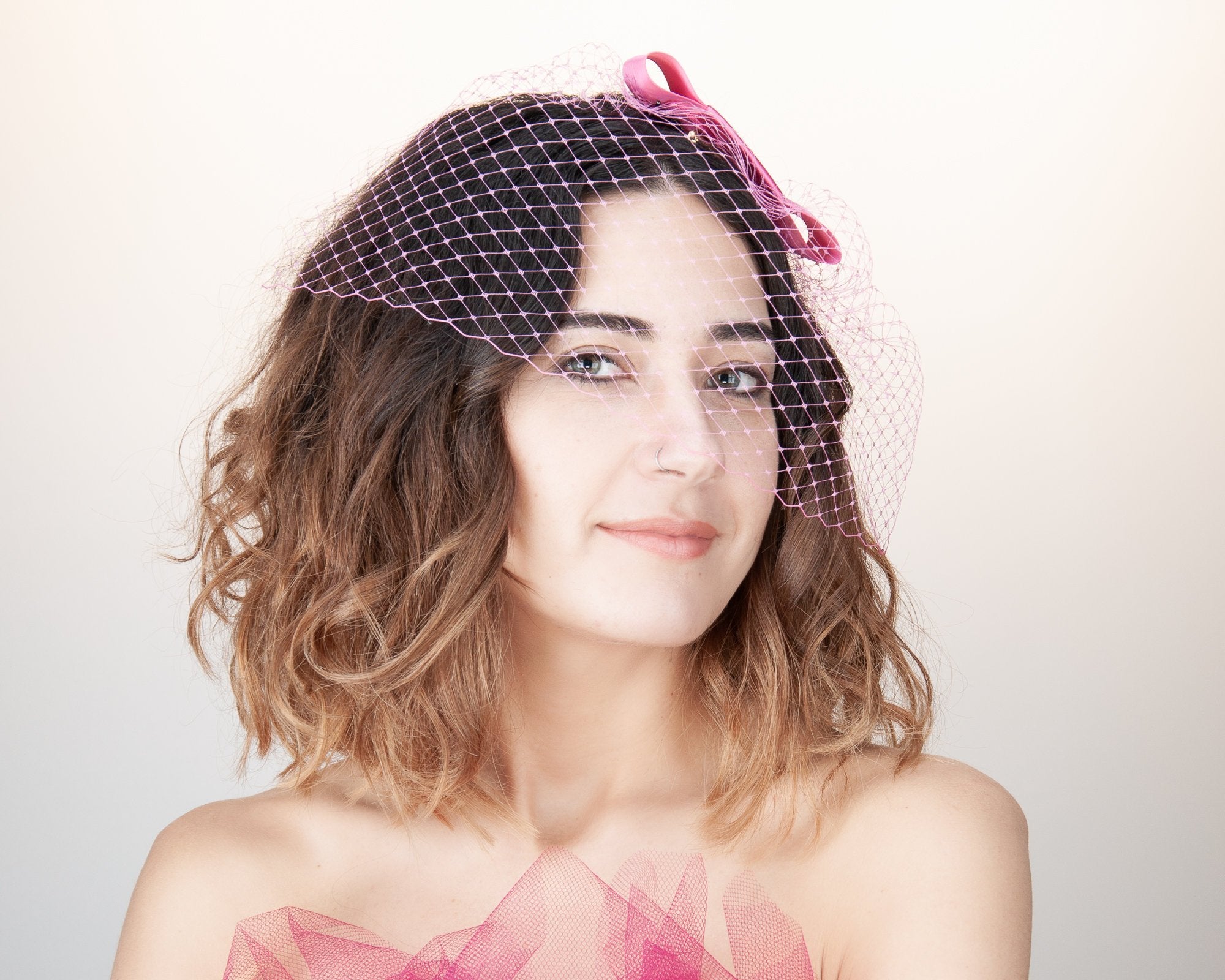 BIRDCAGE FASCINATOR - HEADDRESS WITH A VEIL AND A BOW IN SHOCKING HOT CHERRY PINK © Seegang Berlin