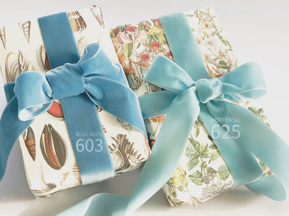 Swiss quality velvet ribbon. 7 light blue tones with delicately shimmering depth of color in 7 widths. Free of harmful substances.