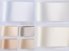 Satin ribbon for bow belts. 7 shades of white with delicately shimmering color depth in 3 widths. Free of harmful substances.