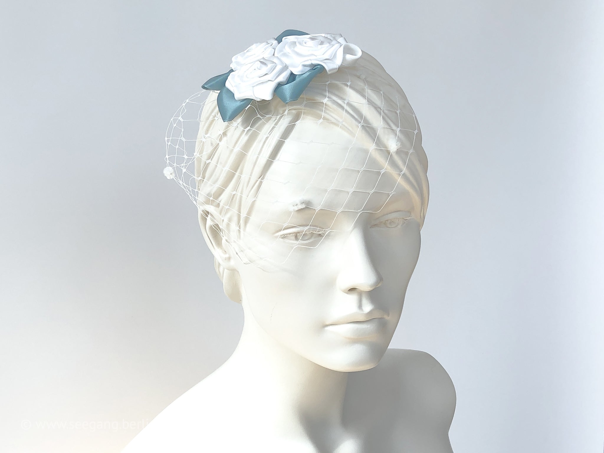 Fascinator, Hair flowers with roses in white, Off white, cream and green leaves.