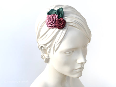 Fascinator Hair flowers with Roses with dusty pink and green leaves.