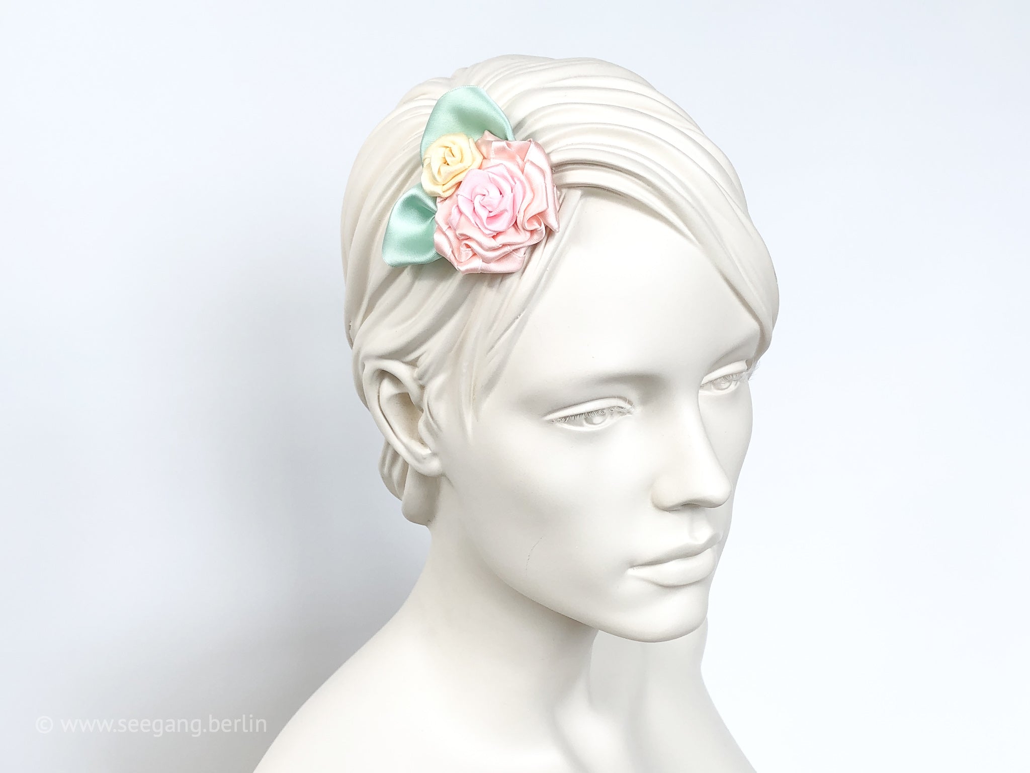 Fascinator, Hair flowers with roses in pastel colors yellow, pink, orange and mint colored leaves.