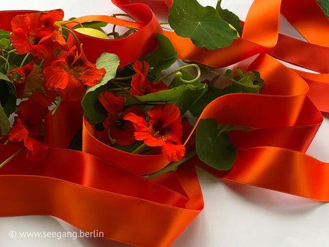 Satin ribbon orange in swiss quality and 100 colors. For tailoring, crafts, deco, gifts, wreaths, floristry, DIY. Width from 0.1 to 2.0 inch.