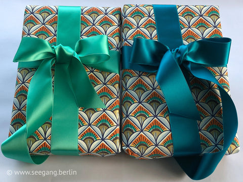 Satin ribbon in green, jade, turquoise, aqua, emerald and 100 colours in swiss quality. Widths from 3 mm to 5 cm. For tailoring, easter wreaths.