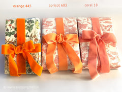 Swiss quality velvet ribbon. 4 shades of orange with a delicately shimmering depth of color in 7 widths. Free of harmful substances.