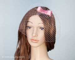 BIRDCAGE FASCINATOR - HEADDRESS WITH A VEIL AND A BOW IN SHOCKING HOT CHERRY PINK © Seegang Berlin