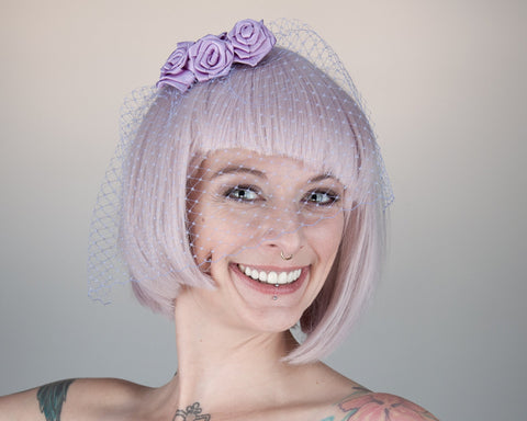 BIRDCAGE - VEIL HEADDRESS WITH ROSES IN SHADES OF PUPRLE FROM LIGHT LAVENDER TO LILAC AND MAUVE © Seegang Berlin