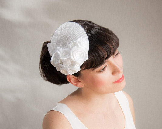 FASCINATOR - BRIDAL HEADPIECE WITH ROSES ON A BRAIDED BASE IN PURE WHITE AND OTHER SHADES © Seegang Berlin