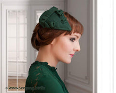 FASCINATOR - DROP SHAPE HEADDRESS WITH DRAPED WITH VELVET RIBBON IN DARK GREEN © Seegang Berlin